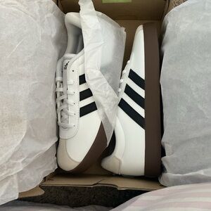 Adidas White and Black Classic Sneakers with Iconic Stripes